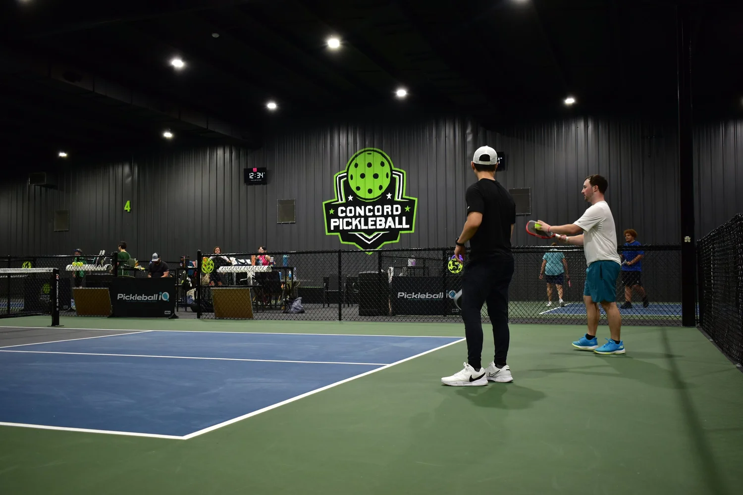 Players and staff together inside Concord Pickleball