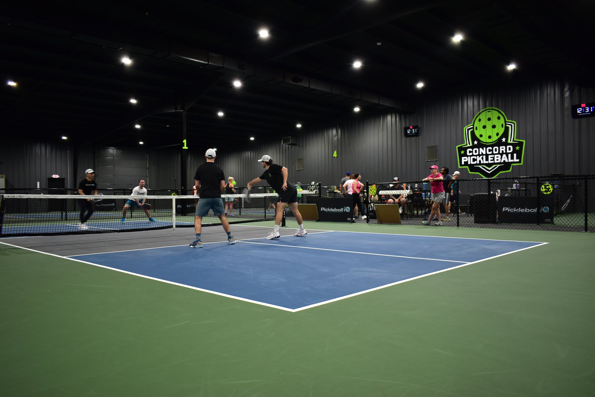 Players enjoying Concord Pickleball's indoor courts